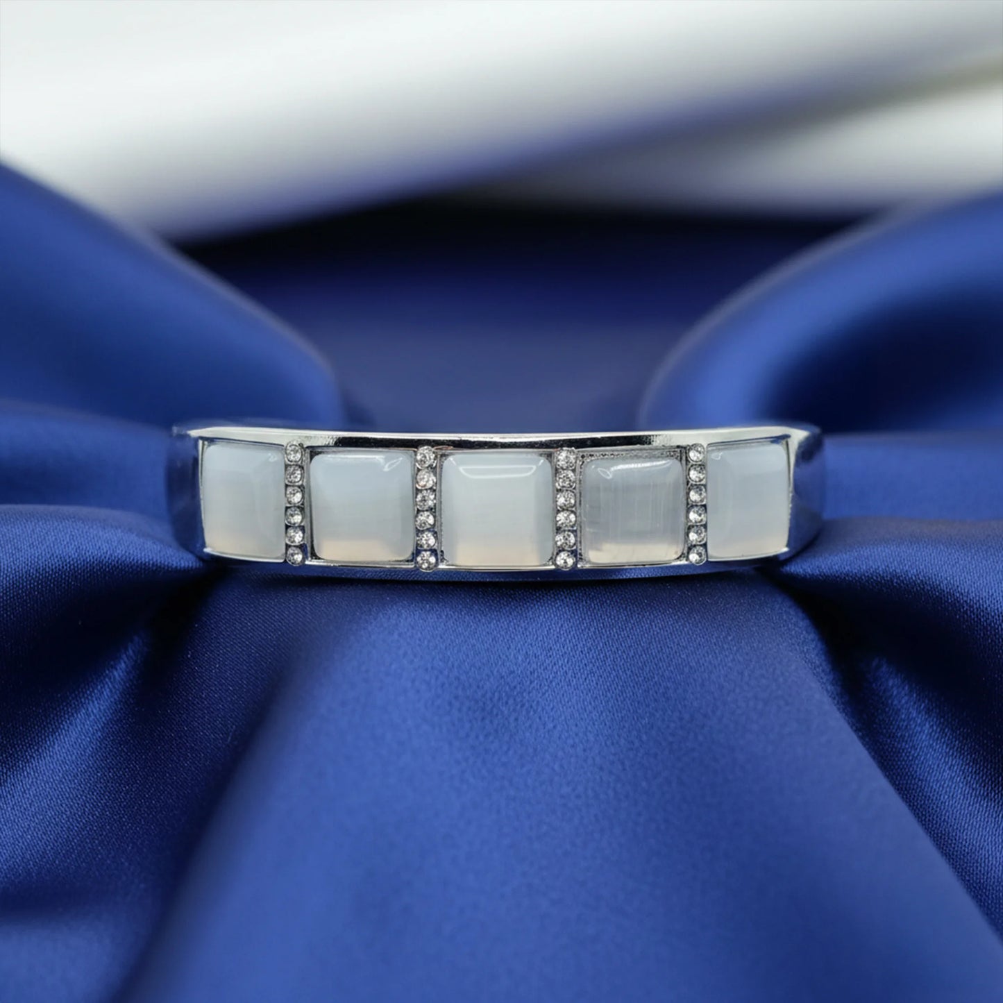 Artificial silver bracelet with square stones and crystal work