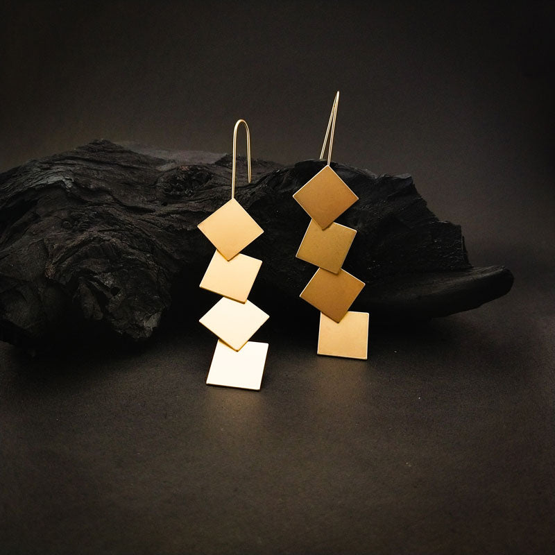 Contemporary golden brass square dangle earrings with a bold cascading square design and sleek metallic finish, perfect for modern and stylish looks.