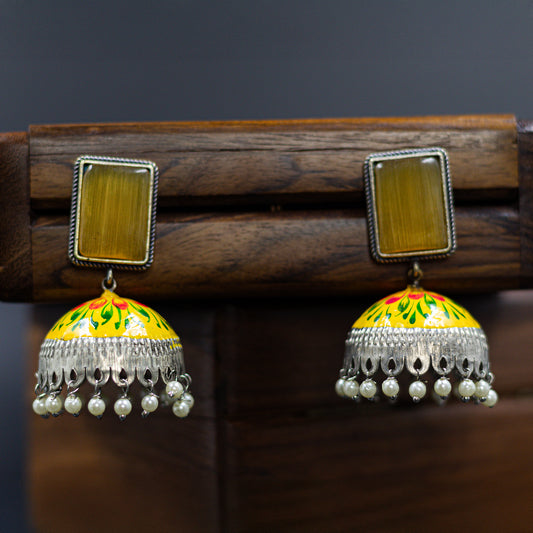 DIVAMAS yellow Meenakari jhumka earrings with floral enamel, antique silver dome, and pearl tassels_01