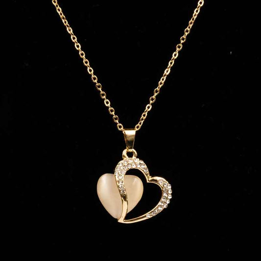 Elegant gold heart pendant necklace featuring a dual-heart design with sparkling crystals and a luminous centerpiece, perfect for special occasions and everyday elegance.