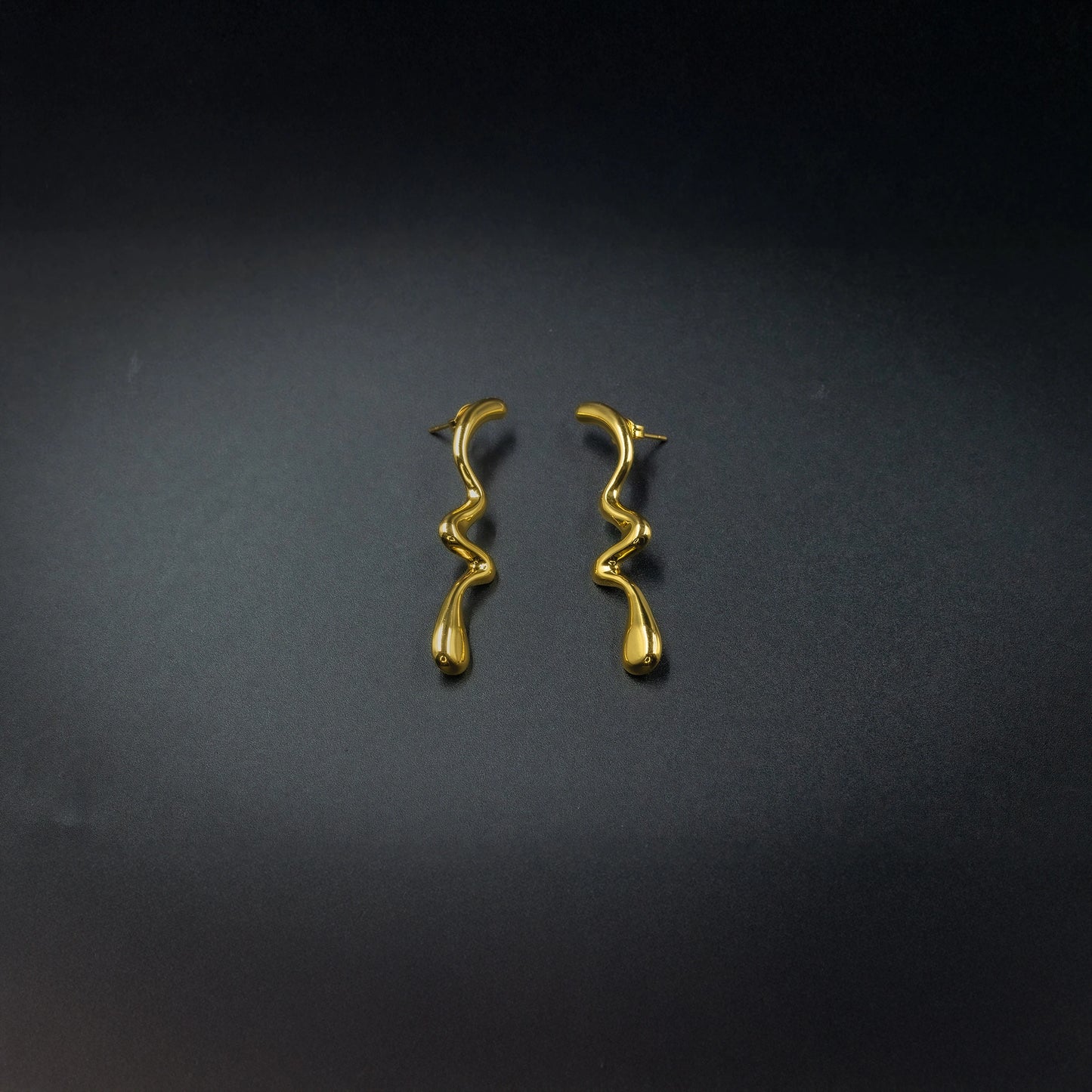 Anti-tarnish gold-color wavy long stud earrings