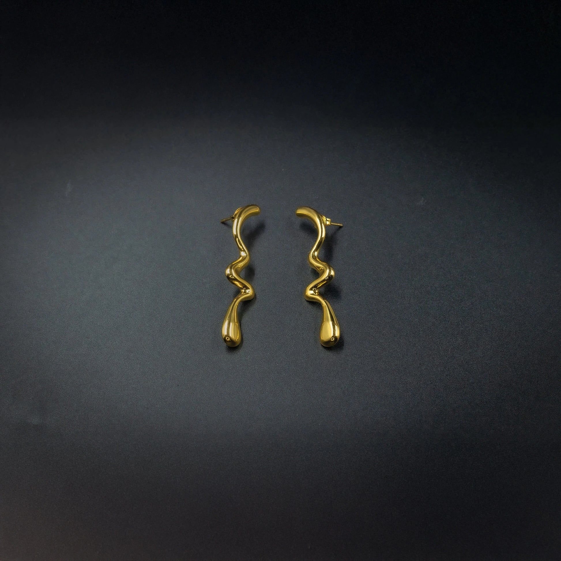 Anti-tarnish gold-color wavy long stud earrings