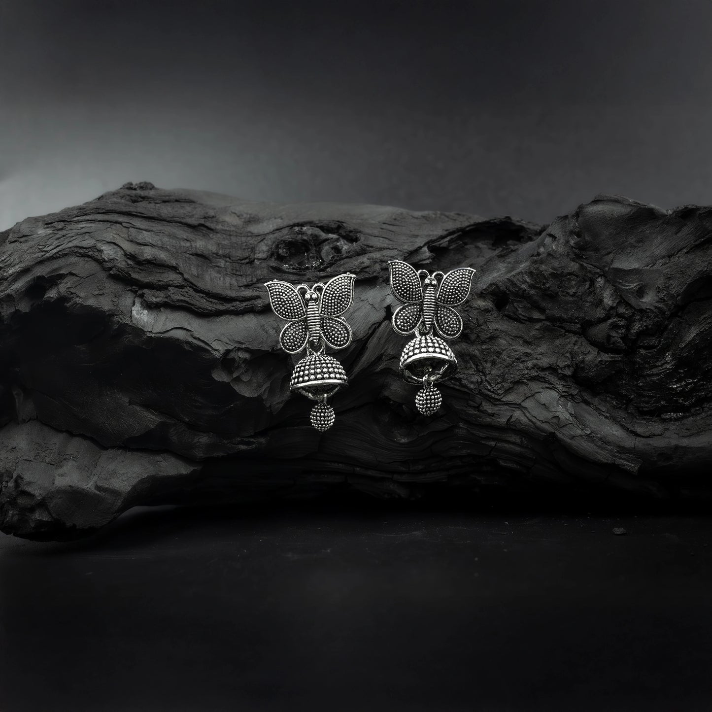 Butterfly design oxidised silver jhumkas