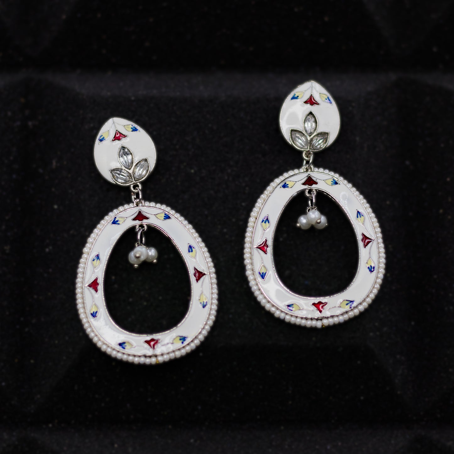 DIVAMAS white Meenakari oval drop earrings with floral hand-painted detail, silver plating, and pearl bead_01

