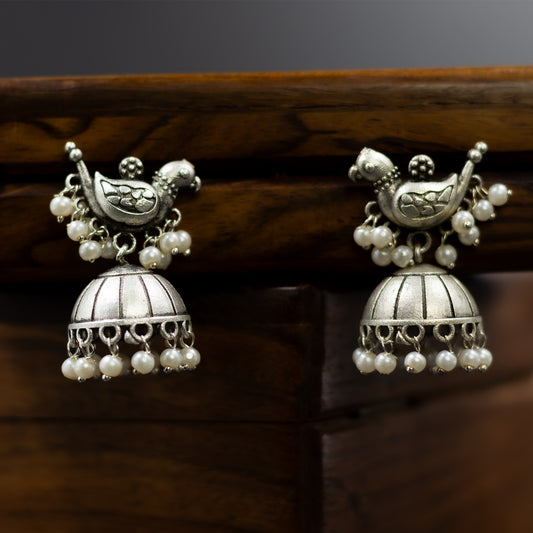 Silver-plated brass jhumka earrings with bird design and pearl drops – DIVAMAS ethnic statement earrings_01


