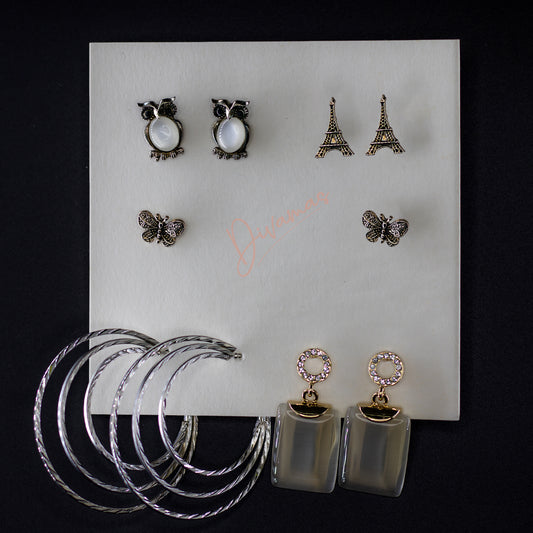 DIVAMAS Women’s Earring Combo featuring Owl Set, Eiffel Tower Set, Butterfly Set, Layered Hoop Set, and Crystal Set; stylish and versatile designs for all occasions.
