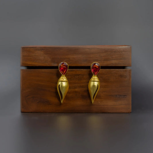 Divamas Gold Plated Shankh Design Earrings with Raw Red Stone