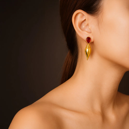 Divamas Gold Plated Shankh Design Earrings with Raw Red Stone