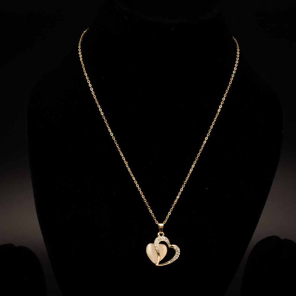 Elegant gold heart pendant necklace featuring a dual-heart design with sparkling crystals and a luminous centerpiece, perfect for special occasions and everyday elegance.