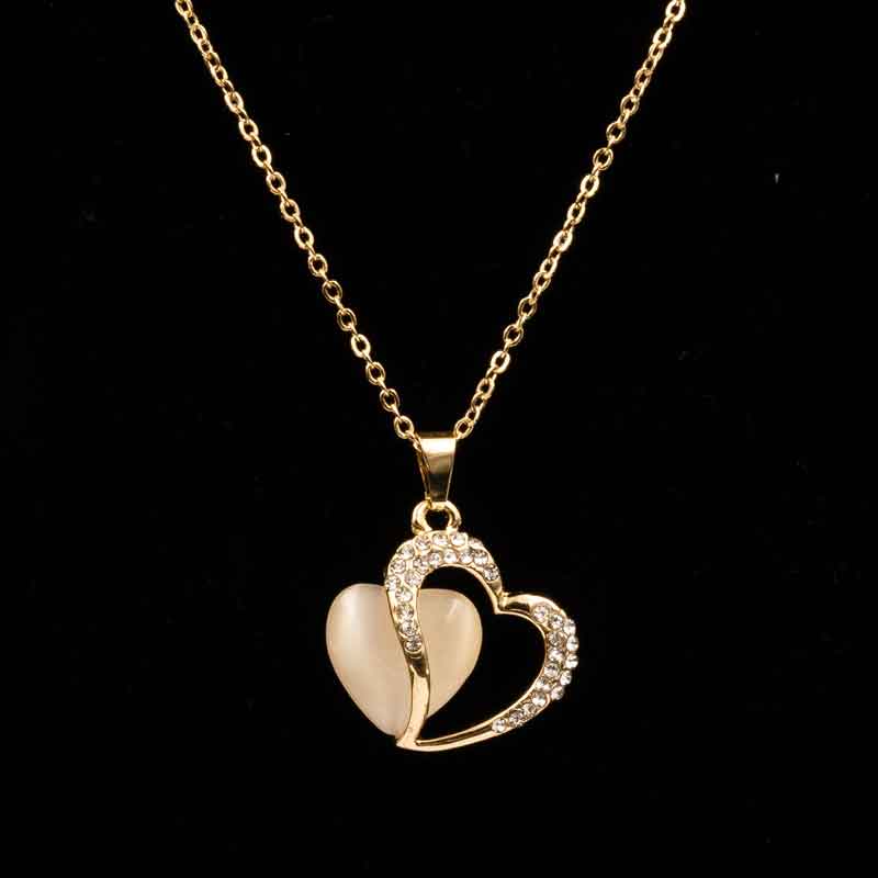Elegant gold heart pendant necklace featuring a dual-heart design with sparkling crystals and a luminous centerpiece, perfect for special occasions and everyday elegance.