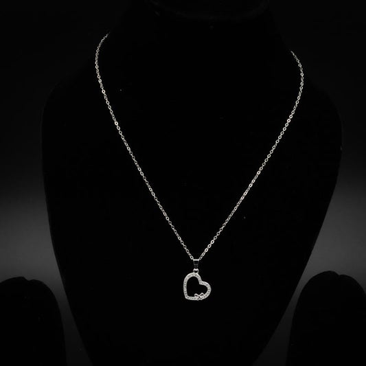 Elegant gold and silver heart pendant necklace featuring an open heart design with sparkling stones and a delicate bow accent, perfect for special occasions and everyday wear.