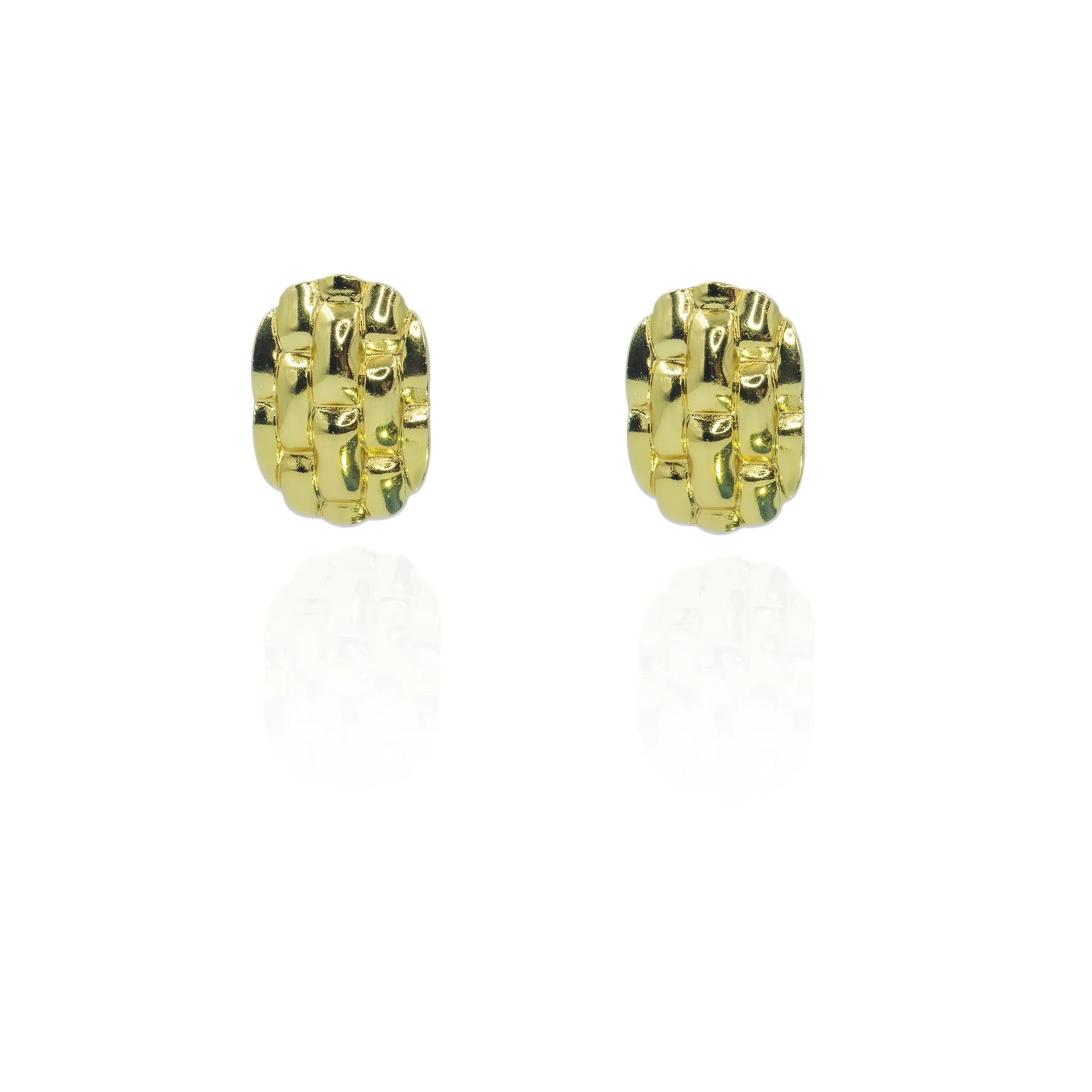 Elegant gold-color designer stud earrings close-up