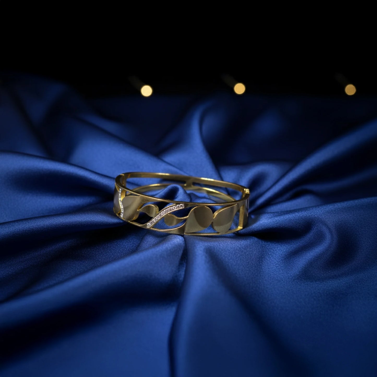 Elegant gold bracelet with crystal wave design