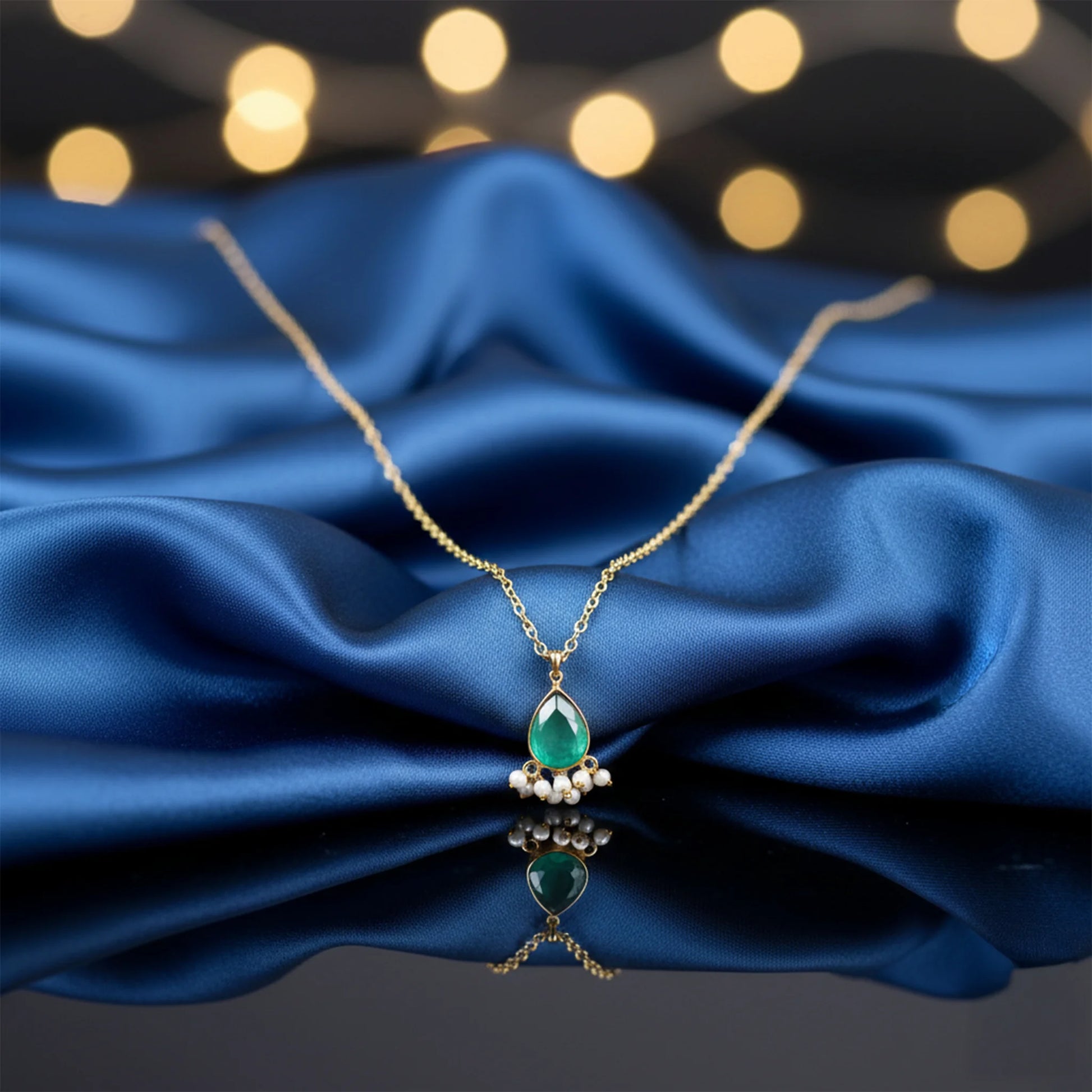 Emerald green stone pendant necklace with pearl drop