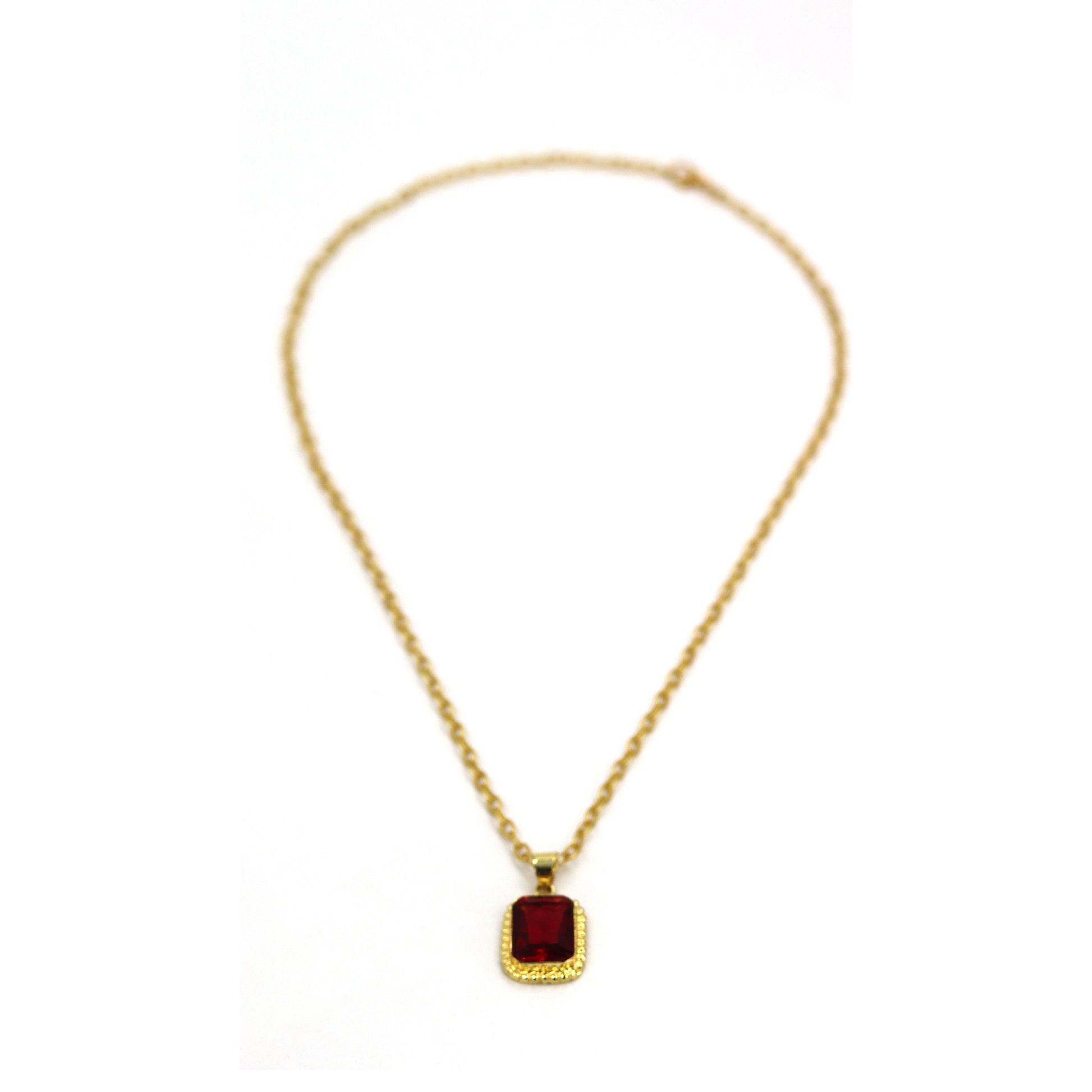 Gold finish ruby pendant close up