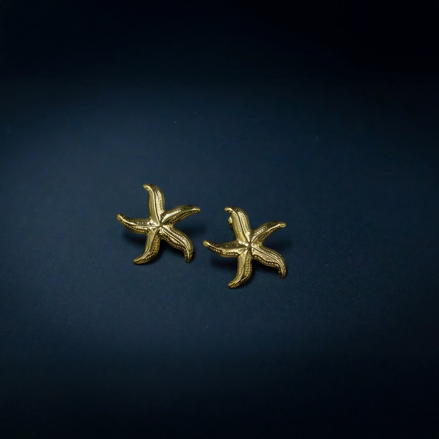 Minimal anti-tarnish gold starfish earrings close-up