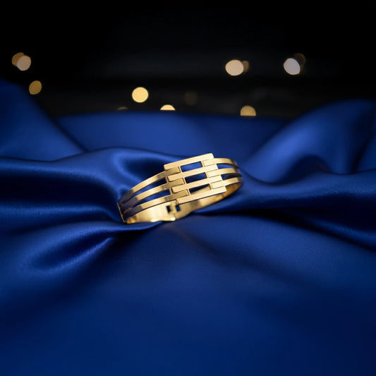 Modern gold bracelet with multi bar pattern