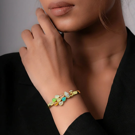 Peacock motif gold bracelet close-up