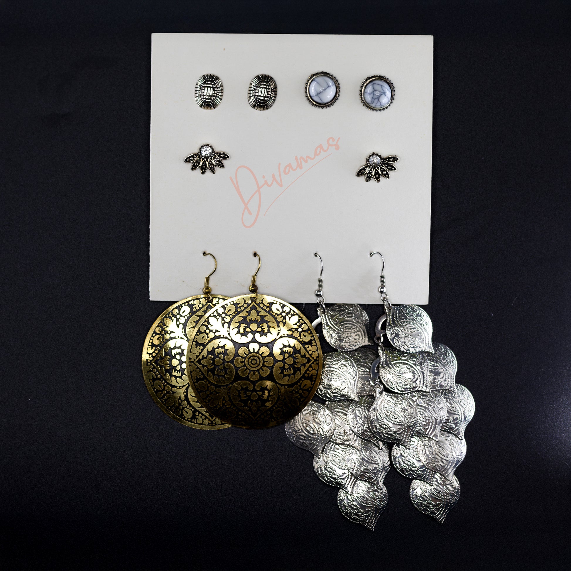 Elegant and trendy DIVAMAS earrings combo – hoops, studs, danglers for women. Perfect for gifting and personal style.

