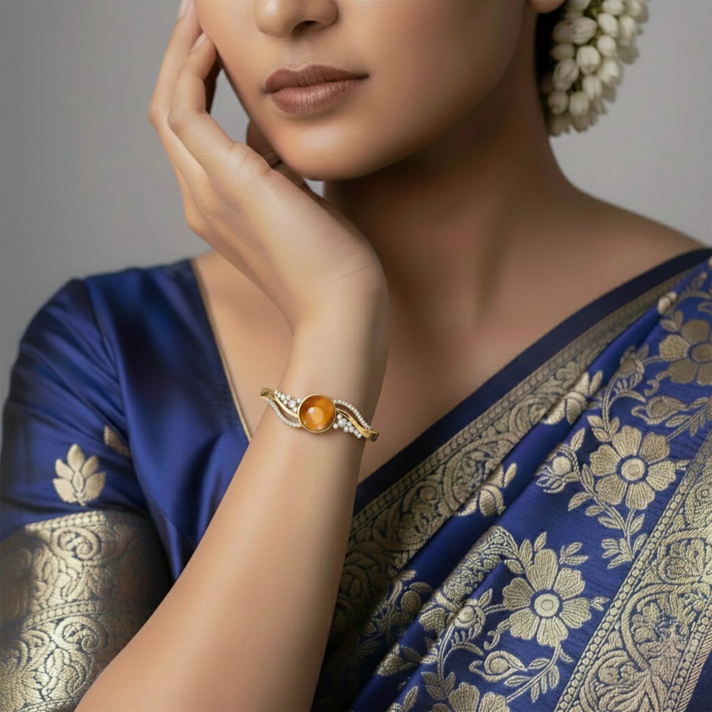 Round stone gold finish bracelet with crystal design