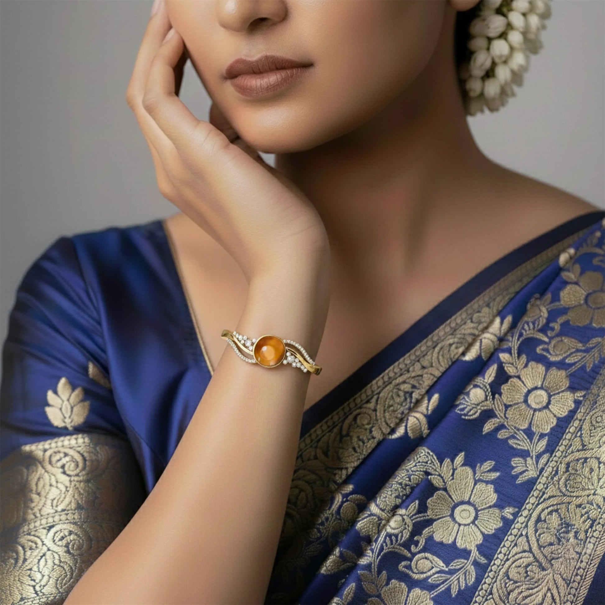 Round stone gold finish bracelet with crystal design